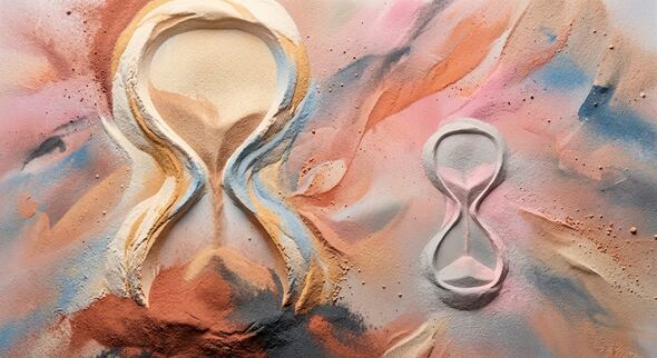 Two hourglasses sculpted in a colored sand floor, one big and one small